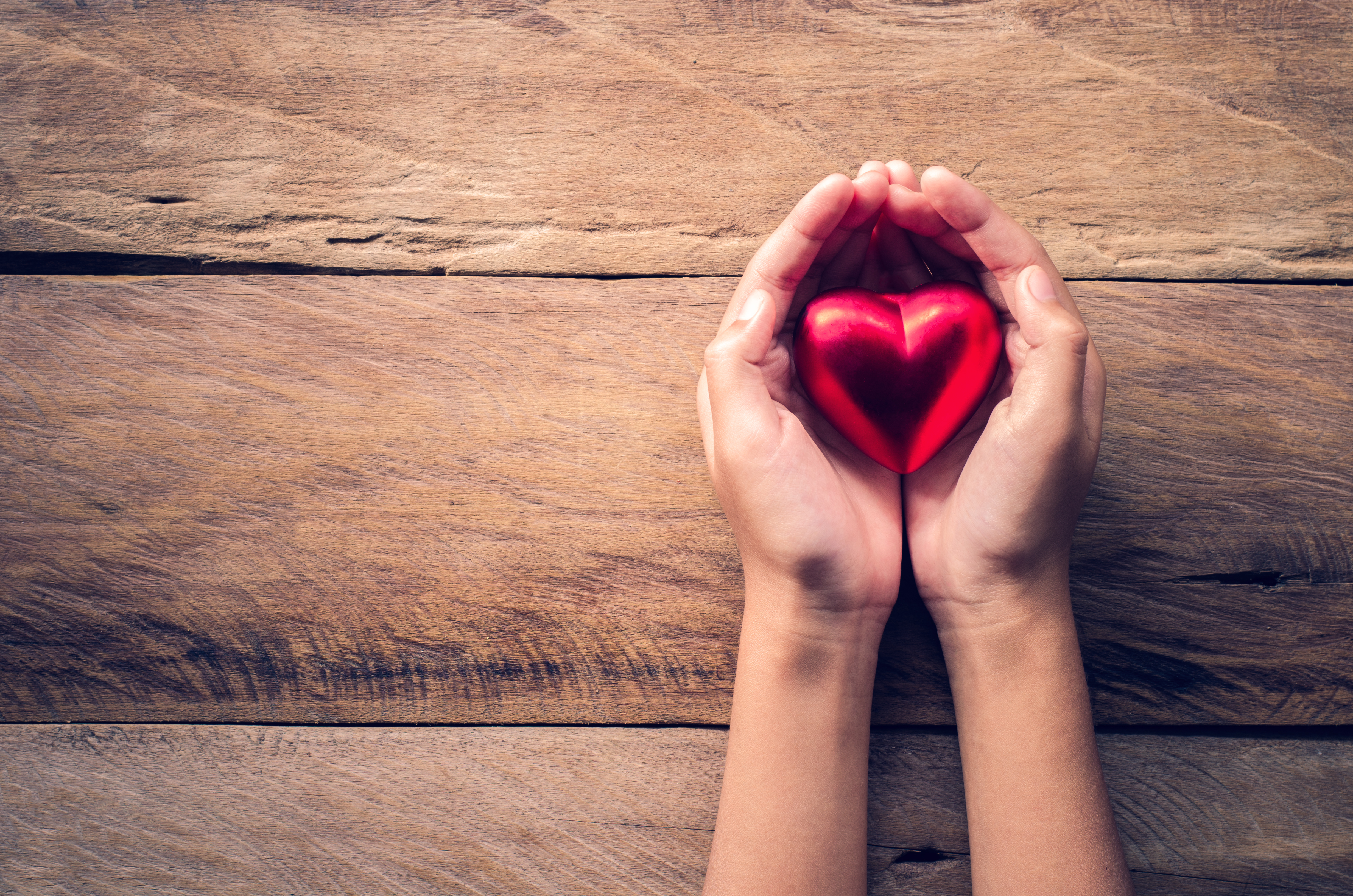 charity hands heart shutterstock_538699558